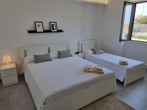 Posteľ alebo postele v izbe v ubytovaní A Casa di Papà by Holiday World