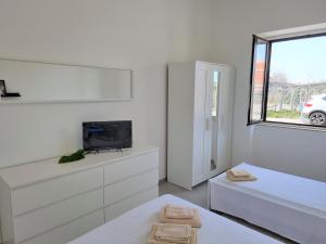 Posteľ alebo postele v izbe v ubytovaní A Casa di Papà by Holiday World