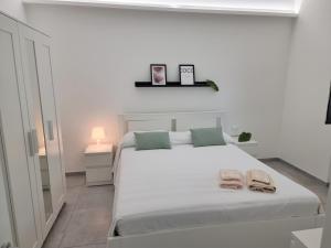 Posteľ alebo postele v izbe v ubytovaní A Casa di Papà by Holiday World