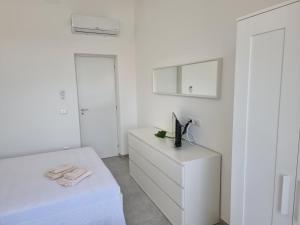 Posteľ alebo postele v izbe v ubytovaní A Casa di Papà by Holiday World