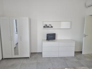 Televízia a/alebo spoločenská miestnosť v ubytovaní A Casa di Papà by Holiday World