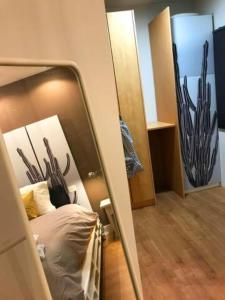 A bed or beds in a room at Nuevo Apartamento en Playa de las Canteras