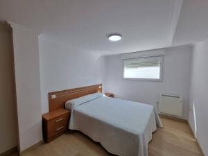Łóżko lub łóżka w pokoju w obiekcie Terrazas del Cantábrico