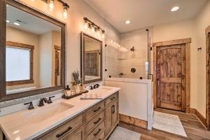 a bathroom with a sink and a large mirror at Mountainside Retreat with Fire Pit in Banner Elk in Valle Crucis +30 photos