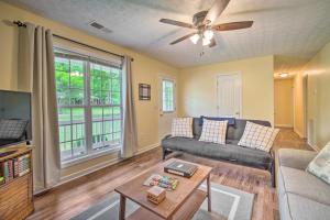 a living room with a couch and a tv at Cartersville Family Home with Spacious Backyard in Cartersville
