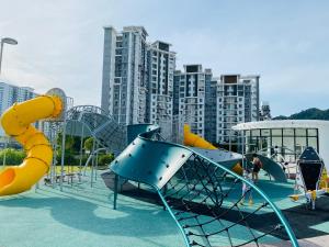 a playground with a slide and slidesktop at Spice Tunas 3B2B House in Bayan Lepas