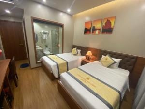 Katil atau katil-katil dalam bilik di Khách sạn Đỉnh Hương Hạ Long