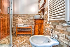 a bathroom with a sink and a shower at Il Raduno in Castel Gandolfo