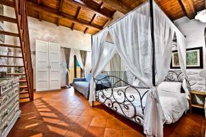 מיטה או מיטות בחדר ב-Il Raduno