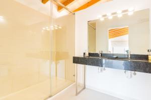 a bathroom with two sinks and a mirror at Son Perot in Maria de la Salut +35 photos