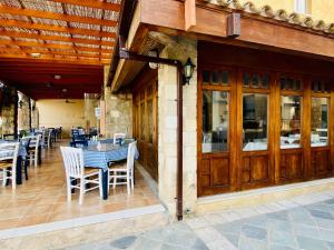 a restaurant with tables and chairs on a patio at basillica 3 bedrooms apartment in Paphos