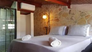 a bedroom with a bed with two pillows on it at Villa Citronella Boutique Hotel in Antalya