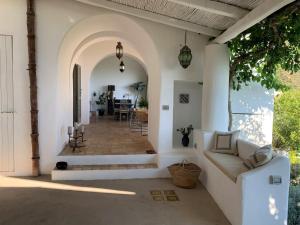 a porch of a house with a couch at Villa Il Melograno in Leni