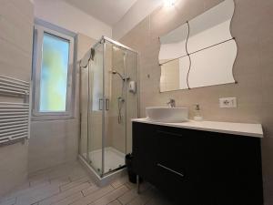 a bathroom with a sink and a shower at Il Guasco Rooms in Ancona +30 photos
