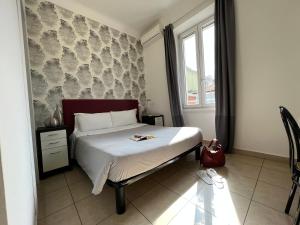 Postel nebo postele na pokoji v ubytování Hotel RossoVino Milano