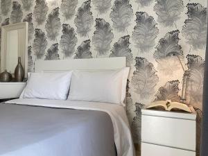 Postel nebo postele na pokoji v ubytování Hotel RossoVino Milano