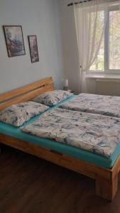 Postel nebo postele na pokoji v ubytování Penzion u Pilaře + 7 fotografií