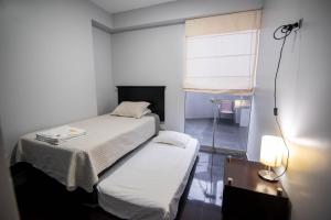 Cama o camas de una habitación en Miraflores Apartment