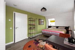 Postel nebo postele na pokoji v ubytování Lowlander BnB