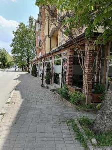 an empty street in front of a brick building at CentrRooms-DS in Struga +7 photos