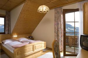 Säng eller sängar i ett rum på Ferienwohnung am Oberrainerhof