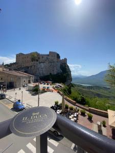 a view of a castle from a balcony at IL DUCA HOUSE e HOLIDAY PRESTIGE in Caccamo