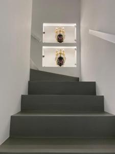 a stairway with green steps in a room at IL DUCA HOUSE e HOLIDAY PRESTIGE in Caccamo +36 photos