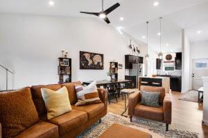 a living room with a couch and a dining room at C&J's Park View in Baraboo