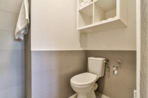 a small bathroom with a white toilet in it at LTC - Apartments Bema przy świętojańskiej in Gdynia