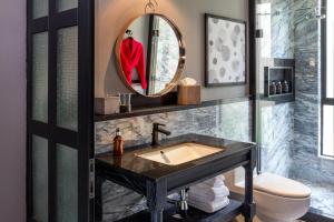 a bathroom with a sink and a mirror at The Wild Oscar in Mexico City +63 photos