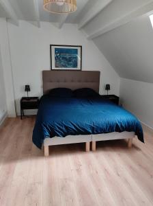 Ένα ή περισσότερα κρεβάτια σε δωμάτιο στο Ty gwenn