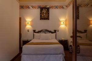 Postel nebo postele na pokoji v ubytování Hotel Rojas Inn