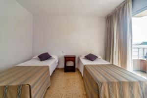 Кровать или кровати в номере Apartamentos Maja