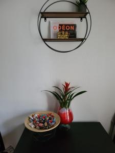 a table with a plate of candies and a bowl of candy at Mon Paris in Paris