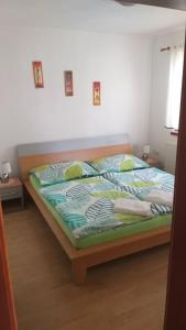 Postel nebo postele na pokoji v ubytování Apartmány u Pilaře