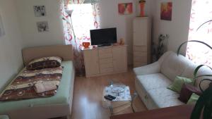 Postel nebo postele na pokoji v ubytování Apartmány u Pilaře