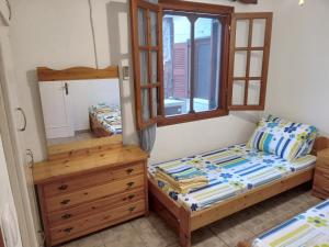 Llit o llits en una habitació de Fantastic House with a Wonderful View of the Sea