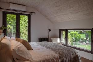 Ένα ή περισσότερα κρεβάτια σε δωμάτιο στο LA NATURE Hostería boutique B&B +53 φωτογραφίες