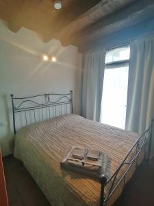 a bedroom with a bed with a tray on it at Casa Sasso in Tavernola Bergamasca