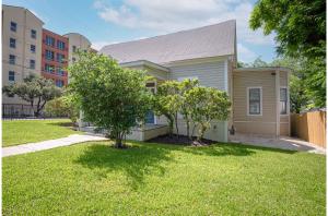a house with a tree in a yard at Incredible New 3BR2BA Near Downtown in San Antonio