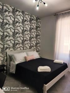 Ein Bett oder Betten in einem Zimmer der Unterkunft A casa di Alma