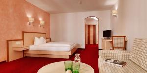 Posteľ alebo postele v izbe v ubytovaní Posthotel Strengen am Arlberg