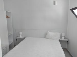 Villetta Terranova 2 tesisinde bir odada yatak veya yataklar