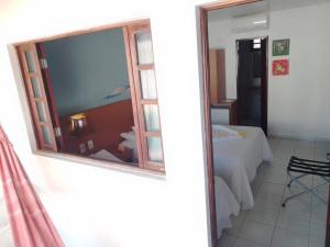 Uma cama ou camas num quarto em Pousada Lua Azul