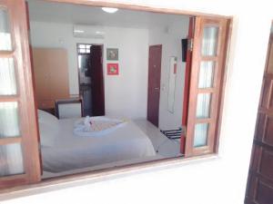 Uma cama ou camas num quarto em Pousada Lua Azul