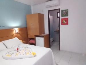 Uma cama ou camas num quarto em Pousada Lua Azul