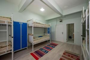 A bed or beds in a room at XALİLA HOSTEL & CAFE LADİES ROOM