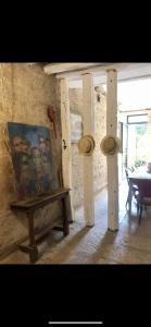 a painting sitting on a bench in a room at Le Clos de Melanie in Flavigny-sur-Ozerain