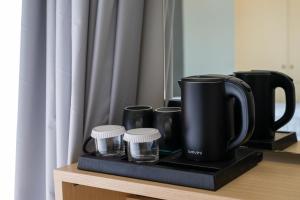 Příslušenství pro přípravu čaje a kávy v ubytování Onar hotel
