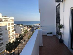 an apartment balcony with a view of a city at Bmar in Quarteira +4 photos